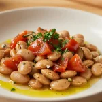 Deliziosi fagioli all'uccelletto preparati nella friggitrice ad aria per un sapore autentico e leggero.