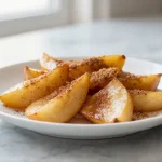 Mela cotta preparata in friggitrice ad aria, un dessert sano e delizioso.