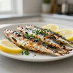 Deliziose sardine grigliate preparate in friggitrice ad aria con una croccantezza perfetta.