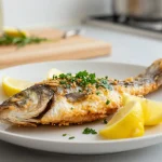 Deliziosa spigola cotta nella friggitrice ad aria, perfetta per una cena leggera.